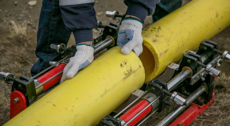 A Person Holding Yellow Pipes